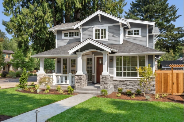 Newly installed gray siding enhances the curb appeal of a residential home.