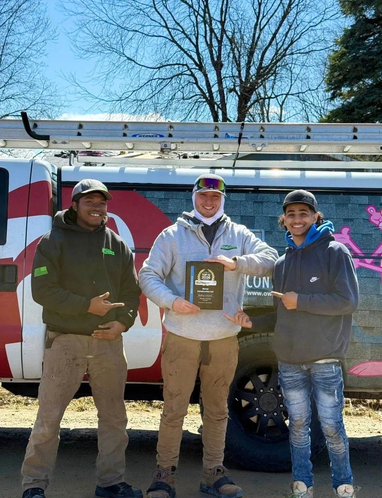 Remer Construction team celebrating a 2026 Top 10 Roofing Contractor award in Wayne County, Michigan.