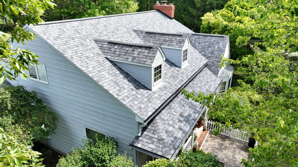 Completed architectural shingle roof with dormers on a residential home