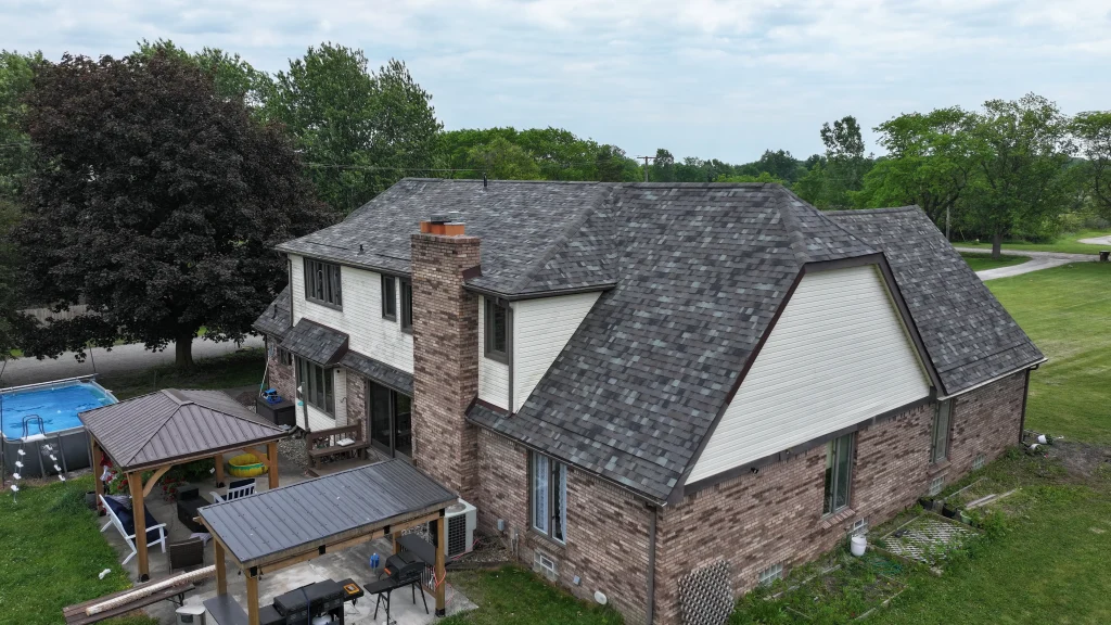 New gray asphalt shingle roof installed on a two-story home