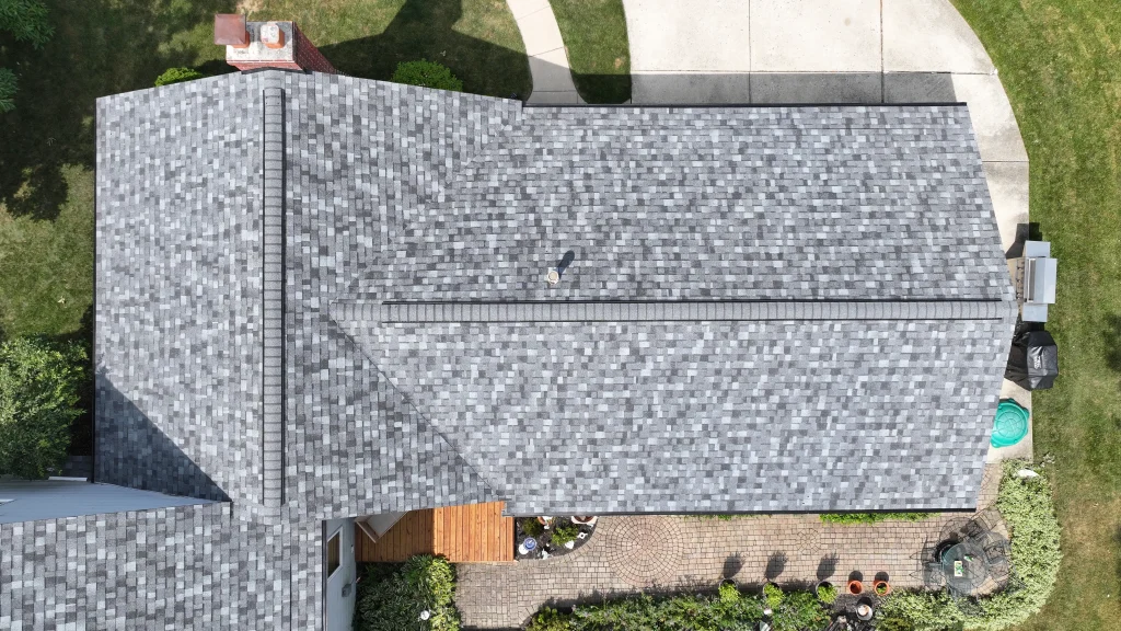 Overhead view of a newly installed gray asphalt shingle roof
