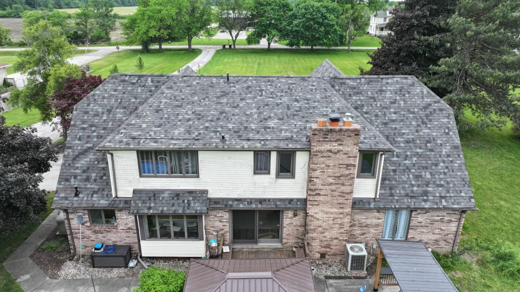 Aerial view of completed residential asphalt shingle roof installation