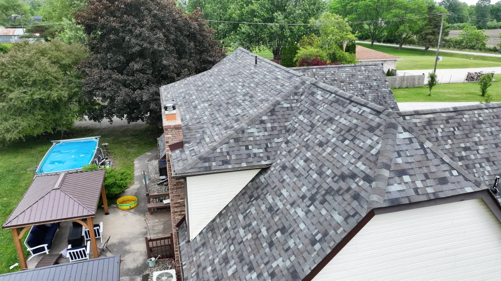 Completed residential roof replacement with gray architectural shingles in Michiana