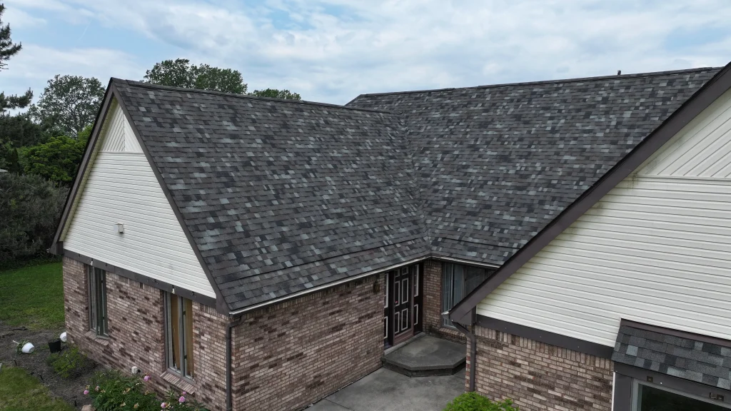 Completed residential roof replacement with gray asphalt shingles